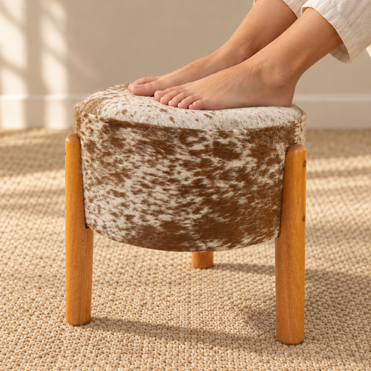 Cowhide Footstool | Black & White Hair-On – Brazilian Cowhide, Eucalyptus Legs — 03 feet resting