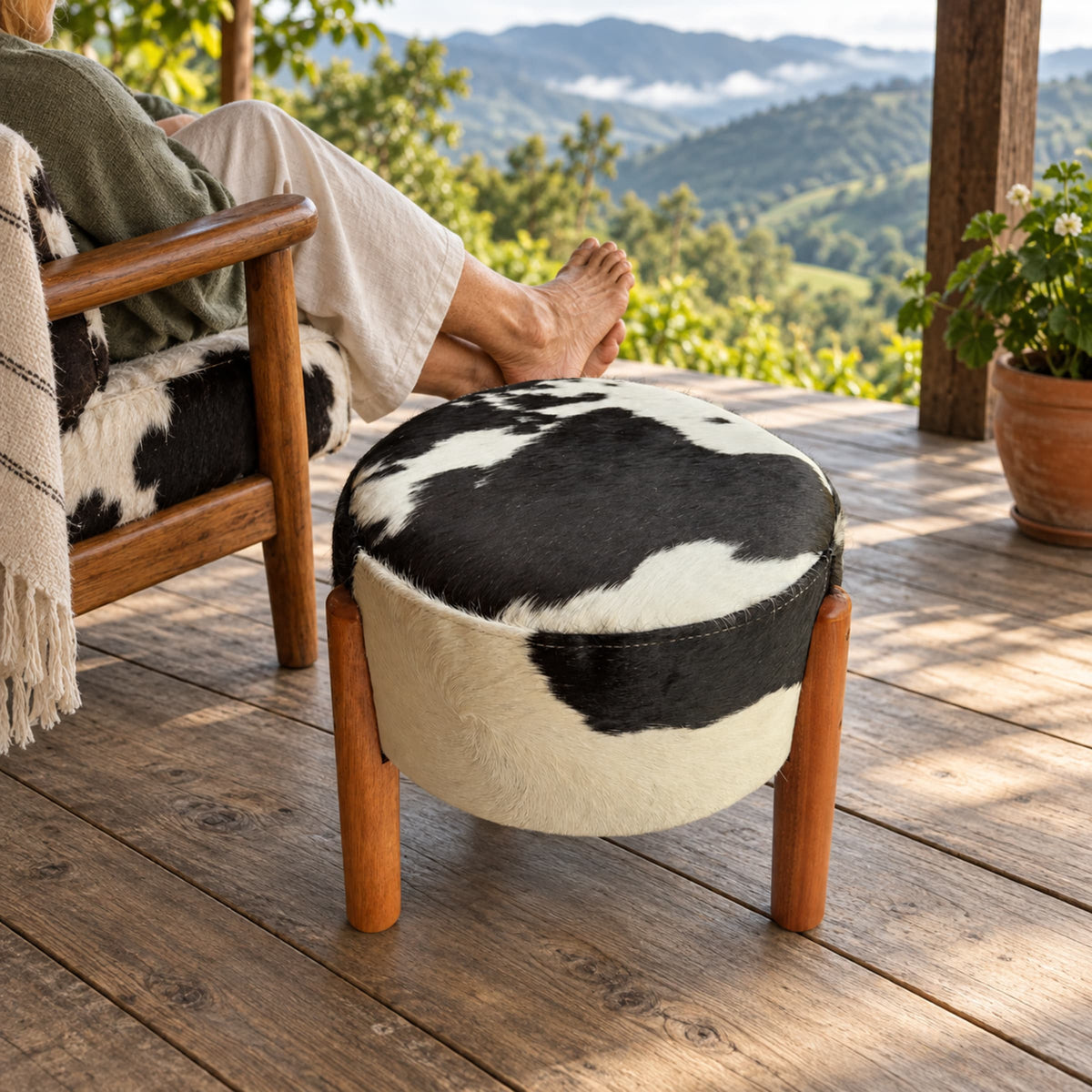 Cowhide Footstool | Black & White Hair-On – Brazilian Cowhide, Eucalyptus Legs styled in a contemporary home setting