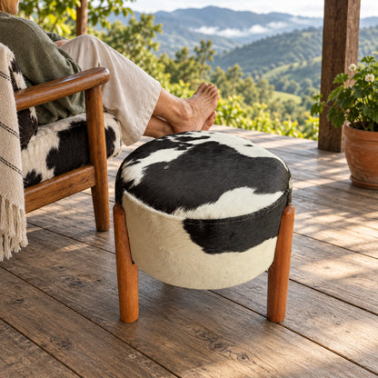 Cowhide Footstool | Black & White Hair-On – Brazilian Cowhide, Eucalyptus Legs styled in a contemporary home setting